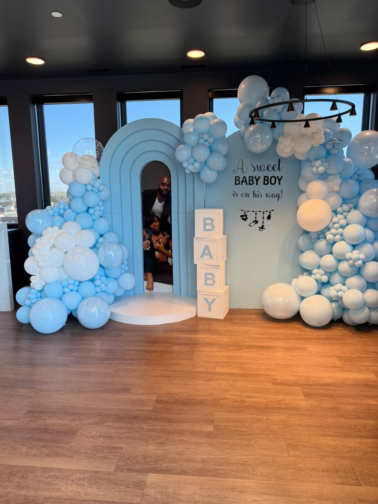 Blue and white baby shower balloon installation