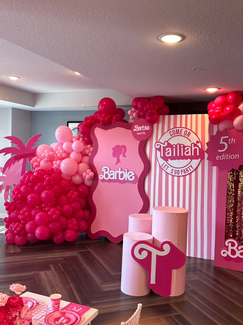 Pink Barbie themed birthday balloon installation
