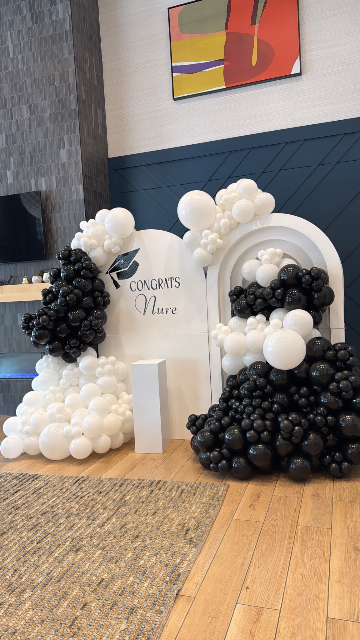 Black and white balloon installation for a milestone celebration