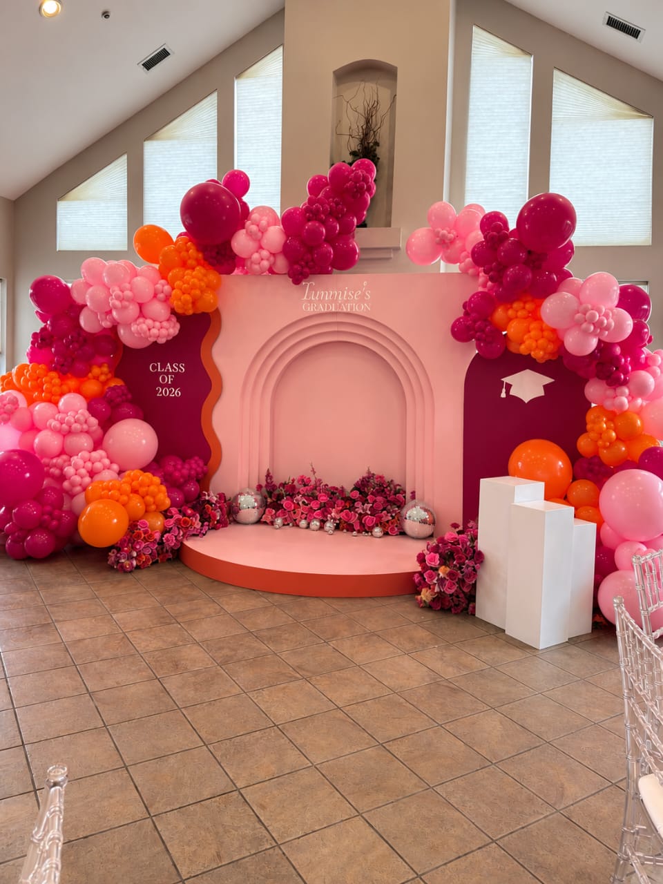 Red and white balloon installation for a graduation celebration