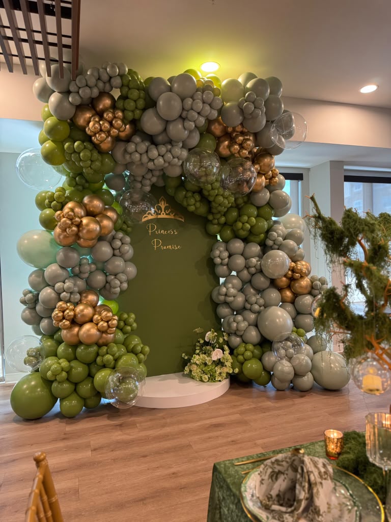 Green, gray and gold balloon installation for a corporate event